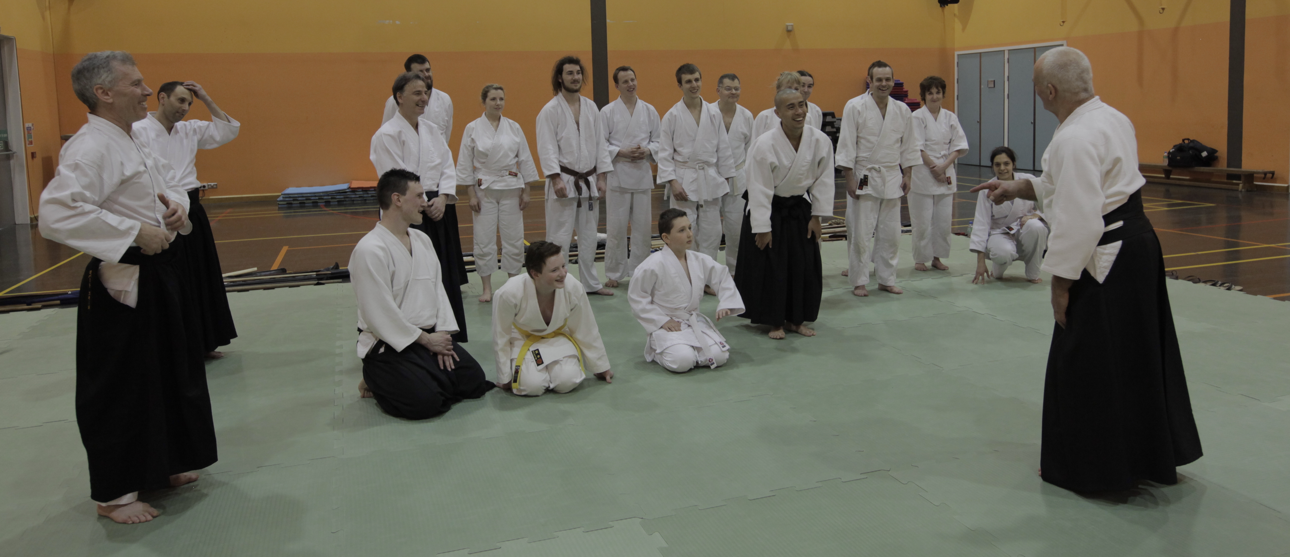 Sensei Terry Ezra Shihan jokes with juniors at the end of a course in Glasgow.